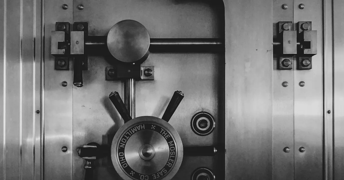 Steel bank vault door with a combination wheel and locking bolts